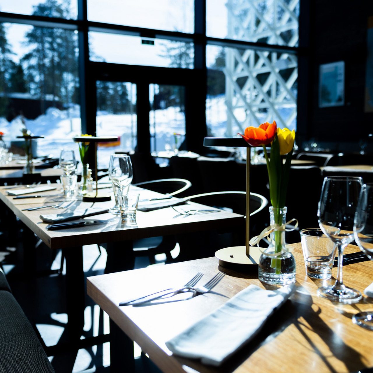 Table setting in Rakas restaurant in sunny winter day.