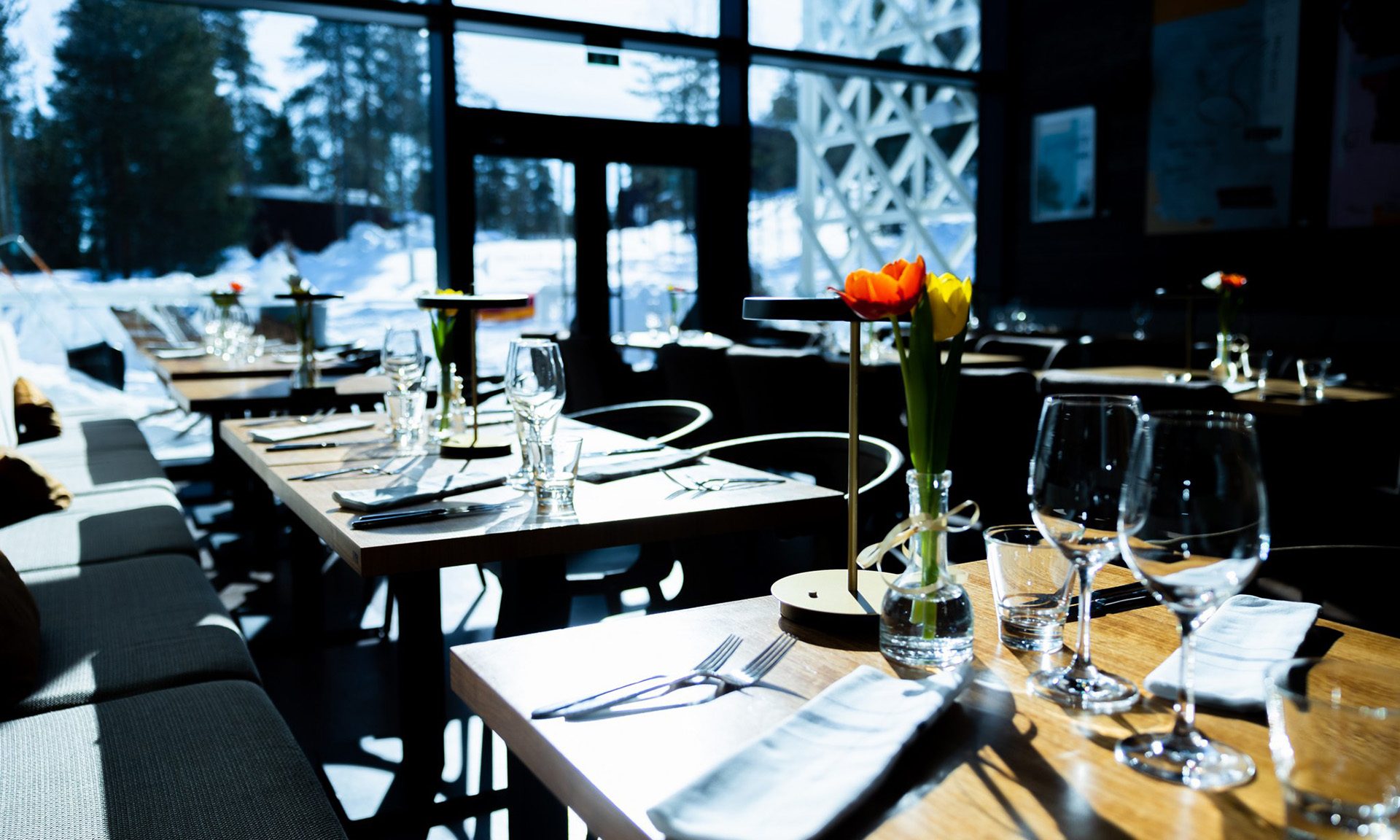 Table setting in Rakas restaurant in sunny winter day.