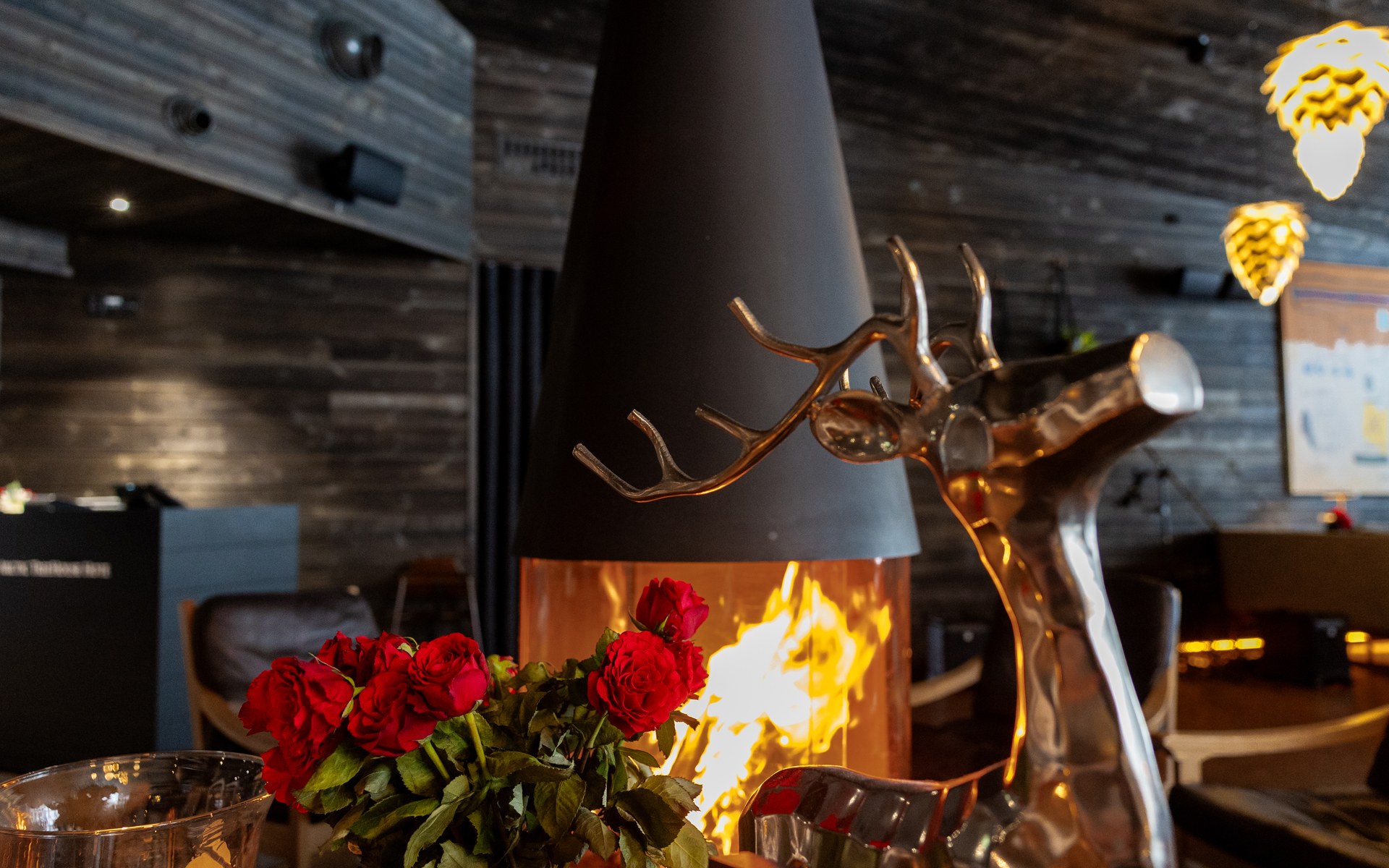 Roses and warm fireplace at the Rakas Restaurant, Rovaniemi.