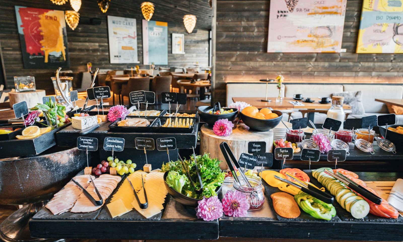 Rakas restaurant offers rich breakfast under the pine cone lamps.