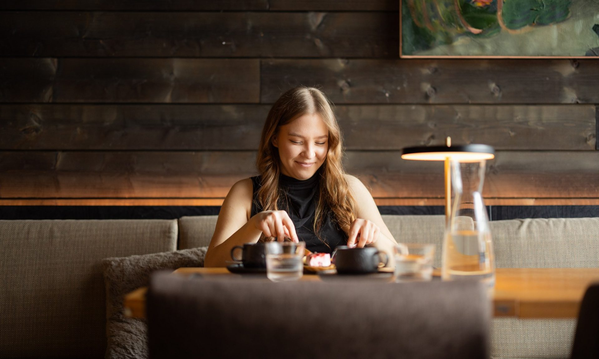 Woman enjoying breakfast in Rakas Restaurant & Bar. | Rovaniemi, Lapland